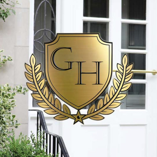 GH shield logo with foliage in gold